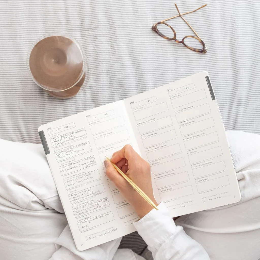 woman writing in journal