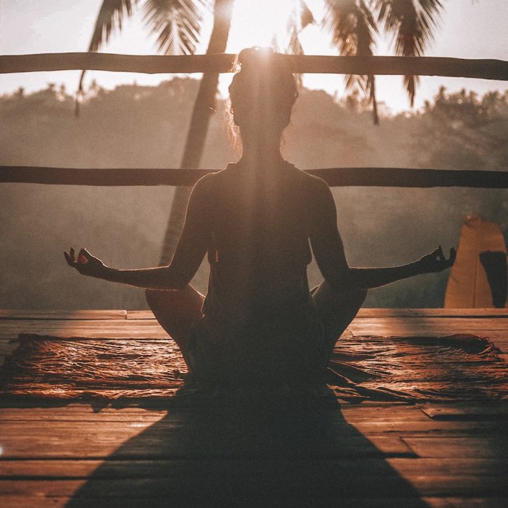 woman meditating outdoors